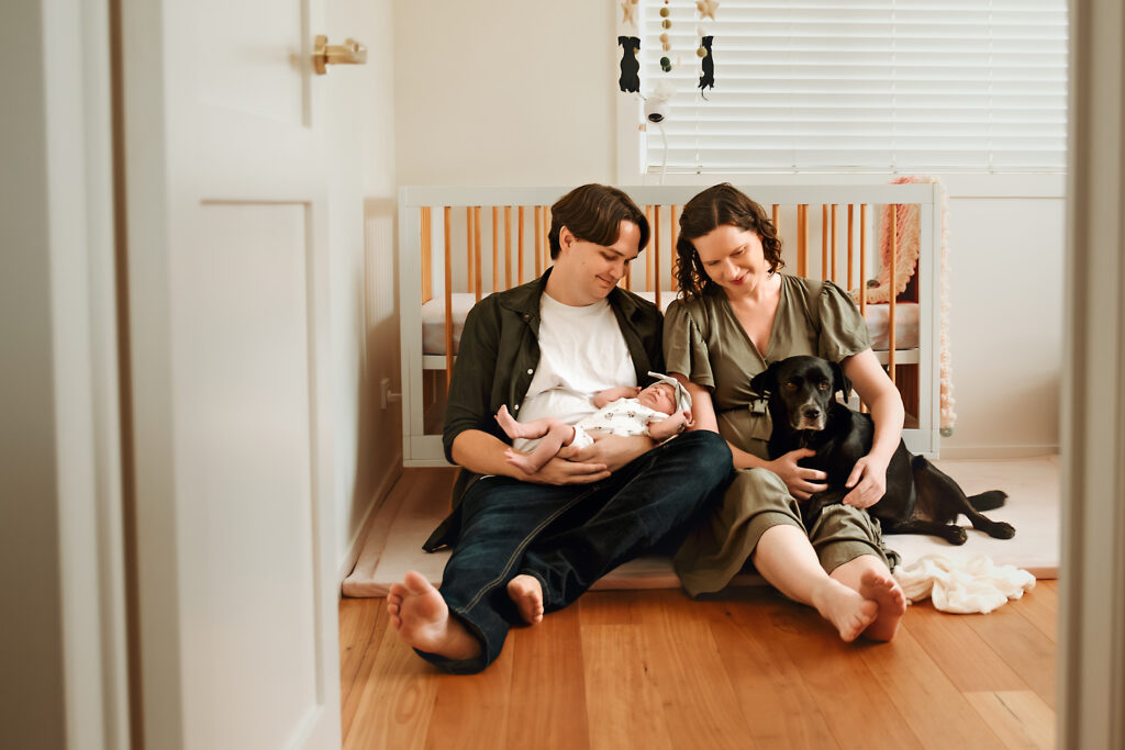 Family bonding with their newborn baby in Brisbane home. Natural birth Brisbane.